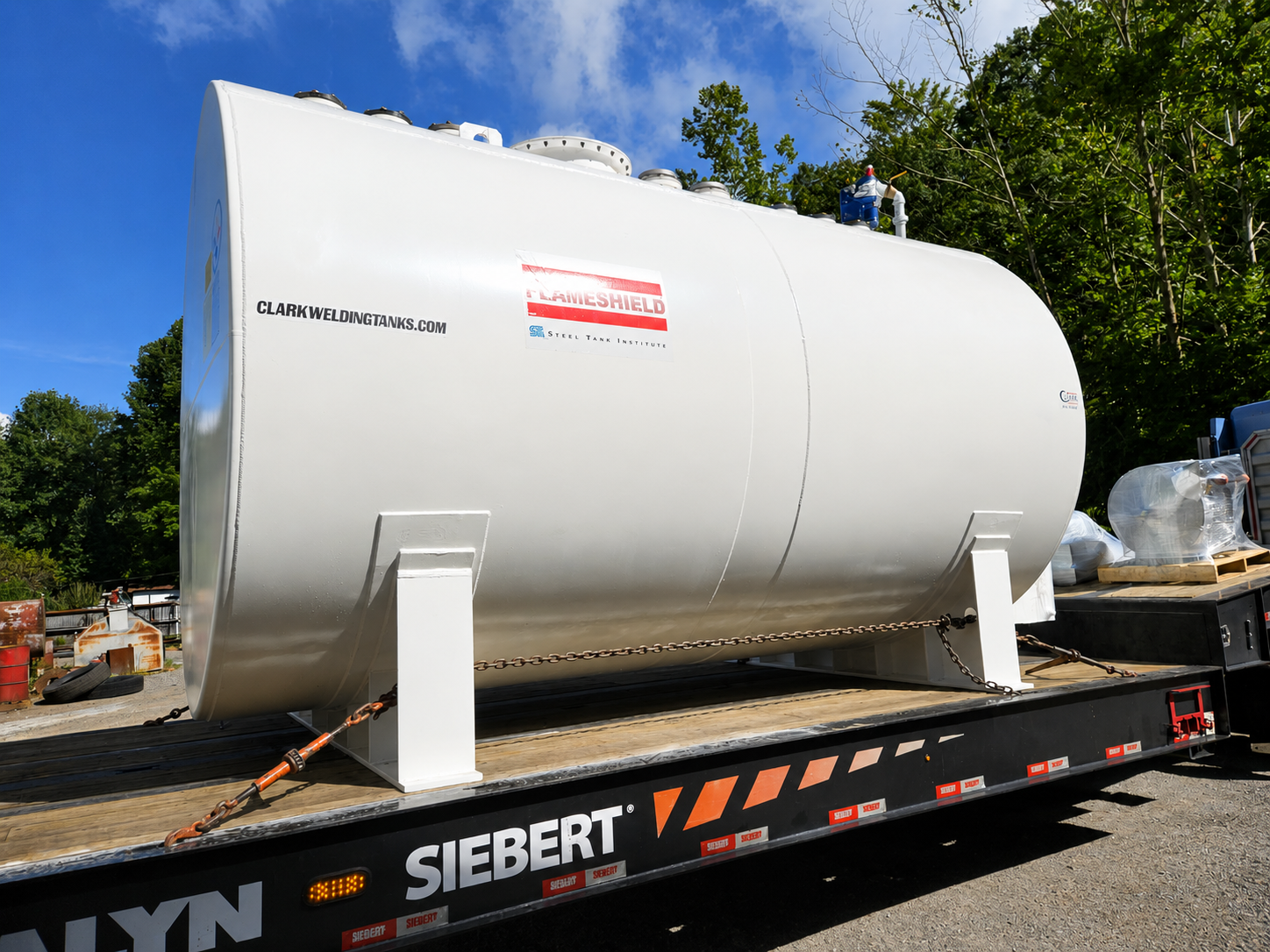 STI Flameshield® tanks above ground on flatbed trailer before delivery